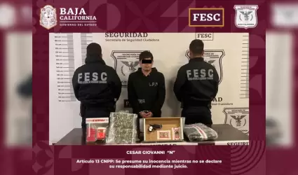 Hombre en posesin de arma de fuego y droga