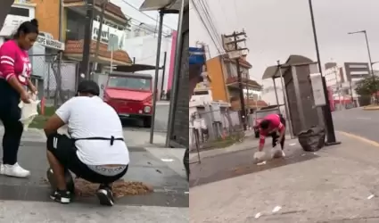 Taqueros recogiendo barbacoa del piso