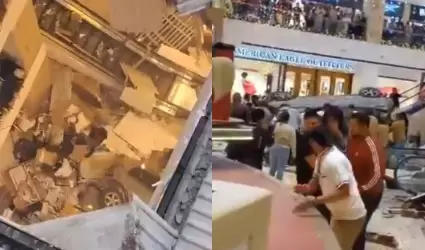 Auto cae en centro comercial