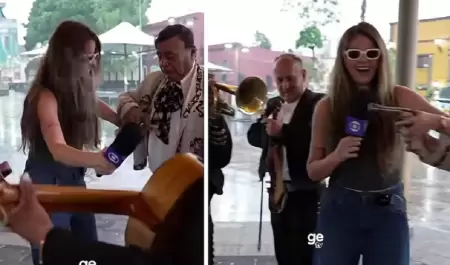 Reportera recibe un arma de un mariachi